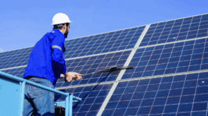 A woman with red hair working on a laptop in a bright, modern room.
